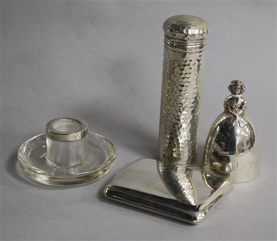 A 1920s silver figural hand bell, a silver toilet jar, silver mounted match strike and a silver cigarette case.